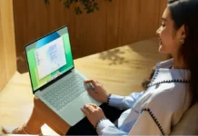 Huawei MateBook 14 HarmonyOS Arrives at $968 With 2.8K OLED, 21-Hour Battery Huawei MateBook 14 HarmonyOS laptop being used by person while seated indoors with display active