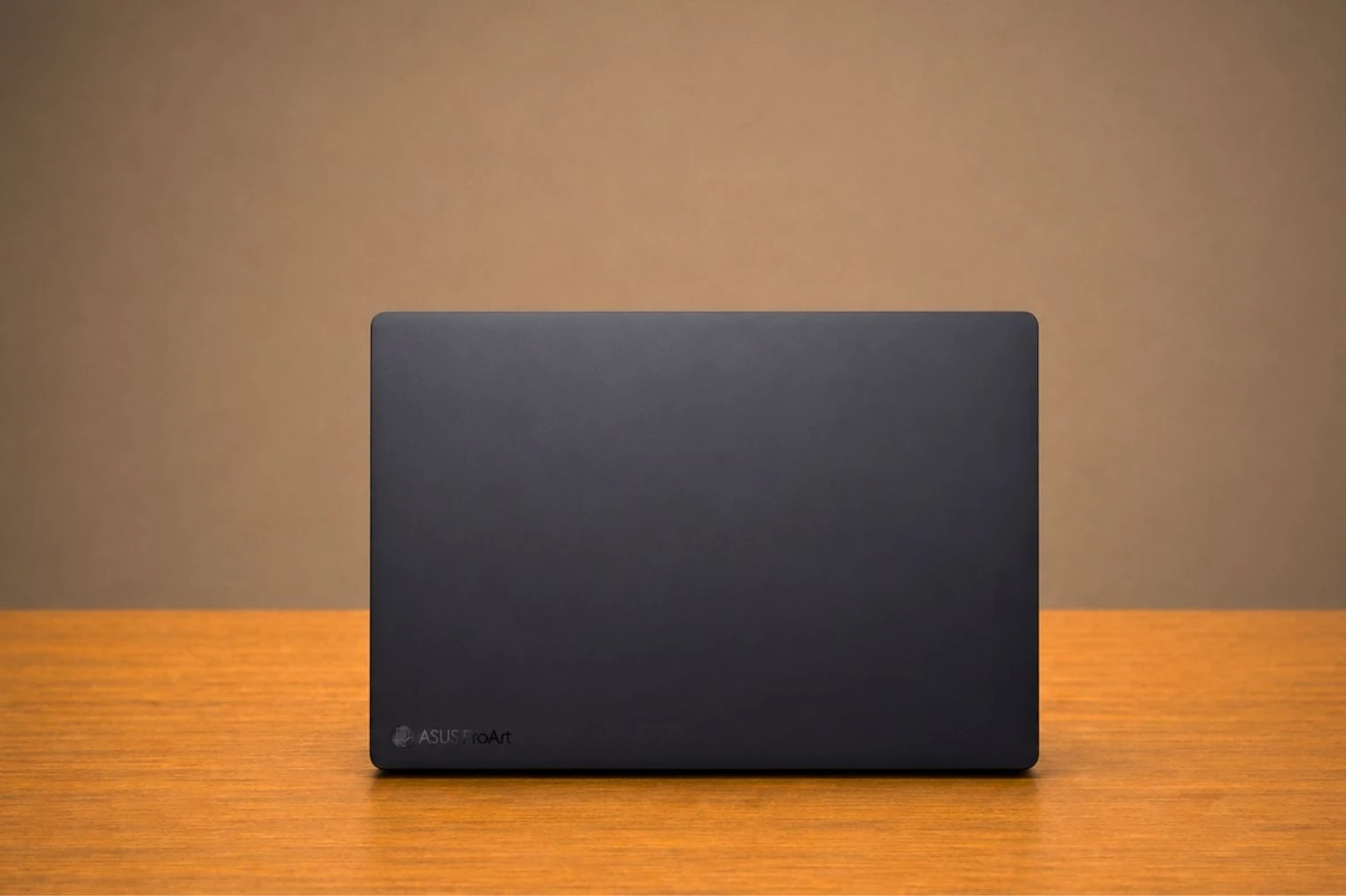 8 Best Laptops for Interior Designer in 2026 54 Rear view of ASUS ProArt P16 laptop with dark matte finish and subtle ProArt branding.