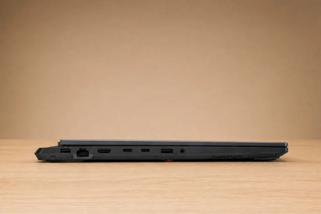 ASUS TUF Gaming F16 Review: Popular Gaming Tested 44 Side profile of ASUS TUF Gaming F16 displaying USB ports, HDMI, Ethernet port, and cooling vents.