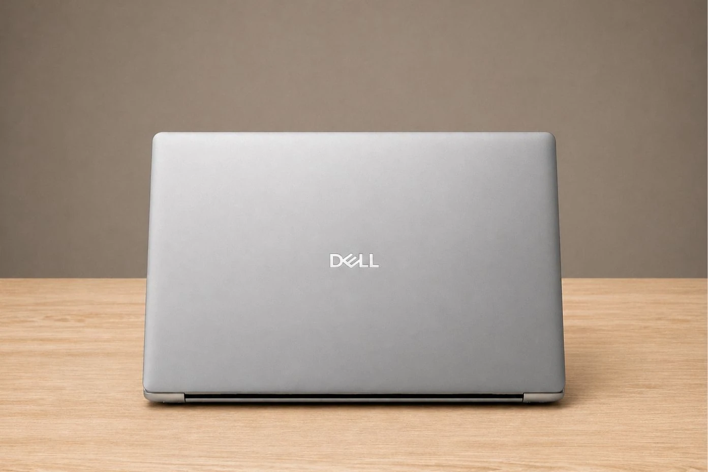 9 Best Laptops for Medical Students in 2026 19 Rear view of Dell XPS 14 showing sleek silver aluminum lid with centered Dell logo.