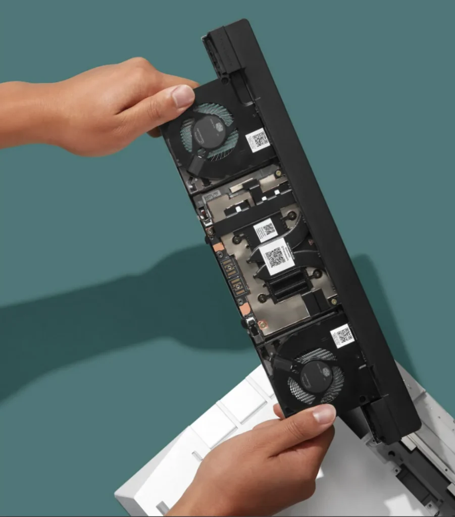 Framework RTX 5070 12GB graphics module being removed showing modular design and internal layout