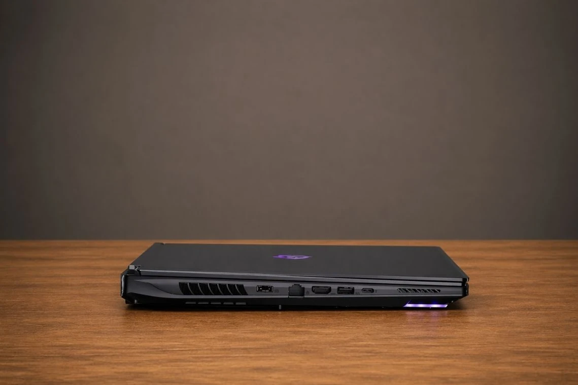 Back side of GIGABYTE AORUS Master 18 displaying HDMI, USB ports, cooling vents, and RGB lighting.
