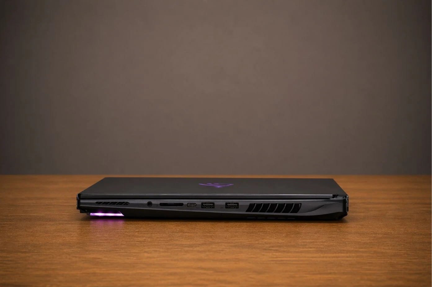 Side profile of GIGABYTE AORUS Master 18 showing USB ports, ventilation, and slim chassis design.