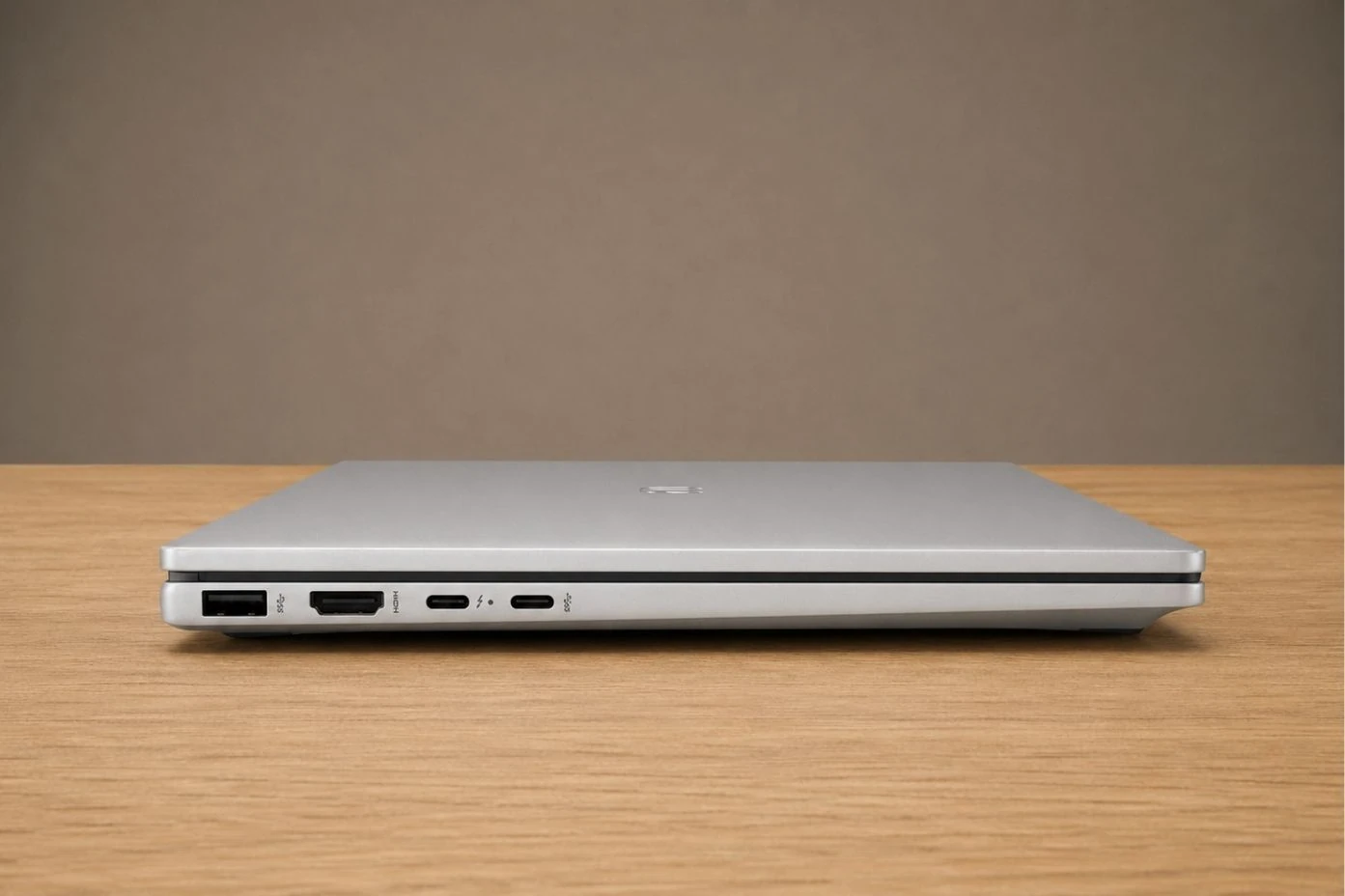 Side view of HP OmniBook 7 Flip showing USB-A, USB-C, HDMI port, and headphone jack.