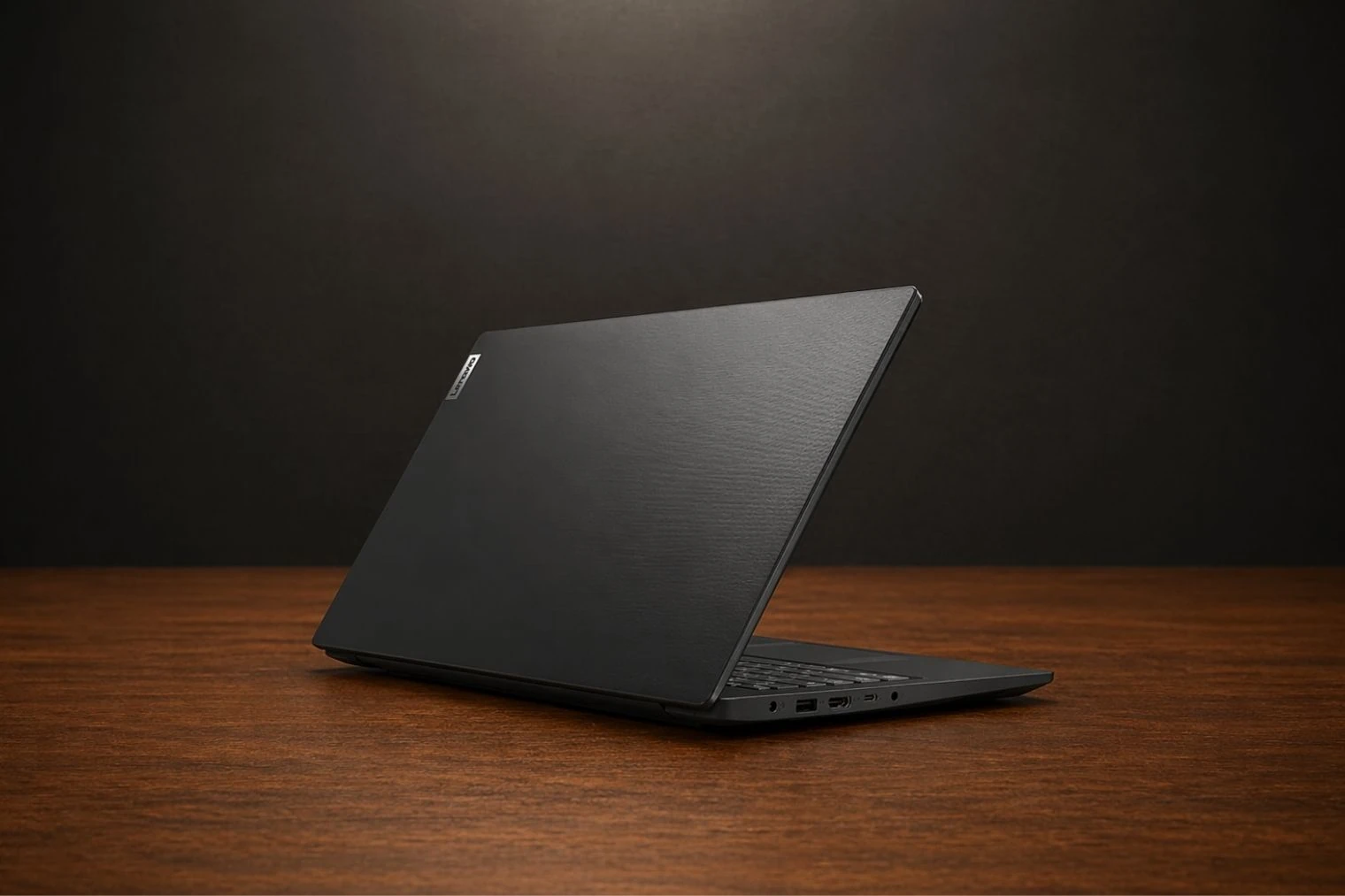 Rear angled view of Lenovo V15 Gen 4 showing minimalist textured lid with Lenovo branding.