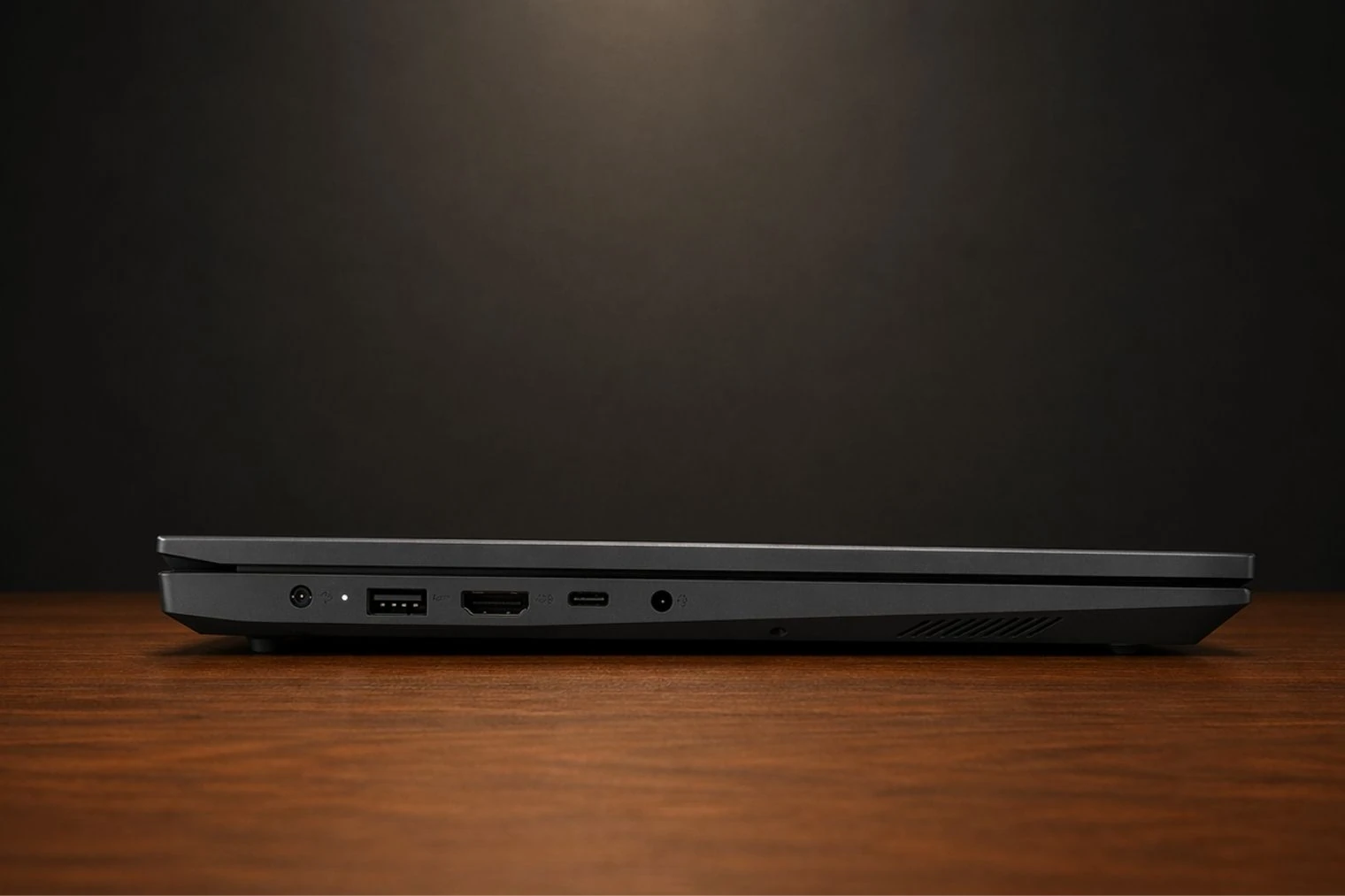 Side profile of Lenovo V15 Gen 4 displaying USB ports, HDMI, charging port, and slim chassis design.
