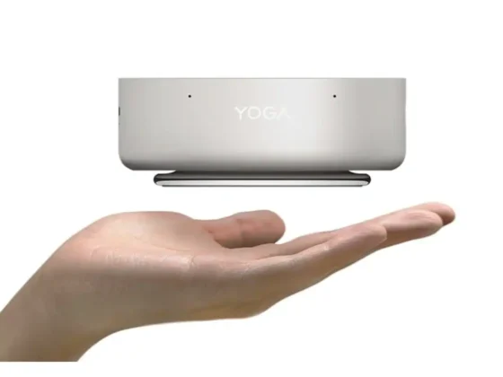 Lenovo Yoga Mini i Gen 11 mini PC shown above a hand to demonstrate compact portable size