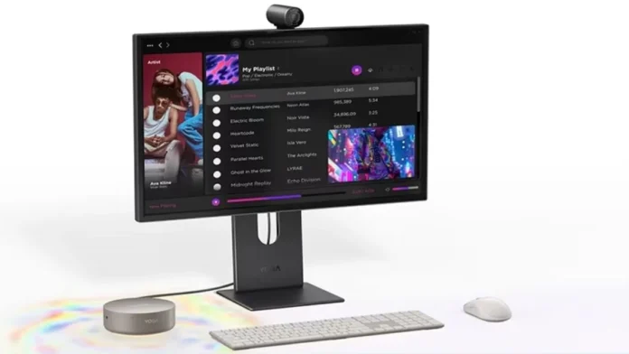 Lenovo Yoga Mini i Gen 11 mini PC connected to a monitor with keyboard mouse and webcam on desk