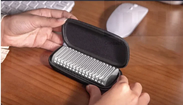 TerraMaster D1 rugged SSD enclosure placed inside a black zippered protective carrying case on a wooden desk with hands opening the case