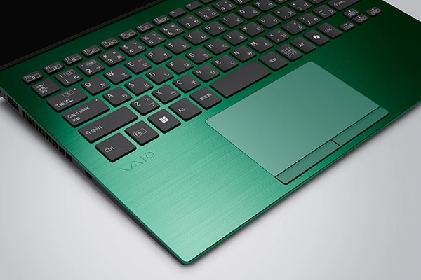 VAIO SX14-R VJS4R2 palm rest area with brushed aluminum finish, large precision trackpad, and clean keyboard layout