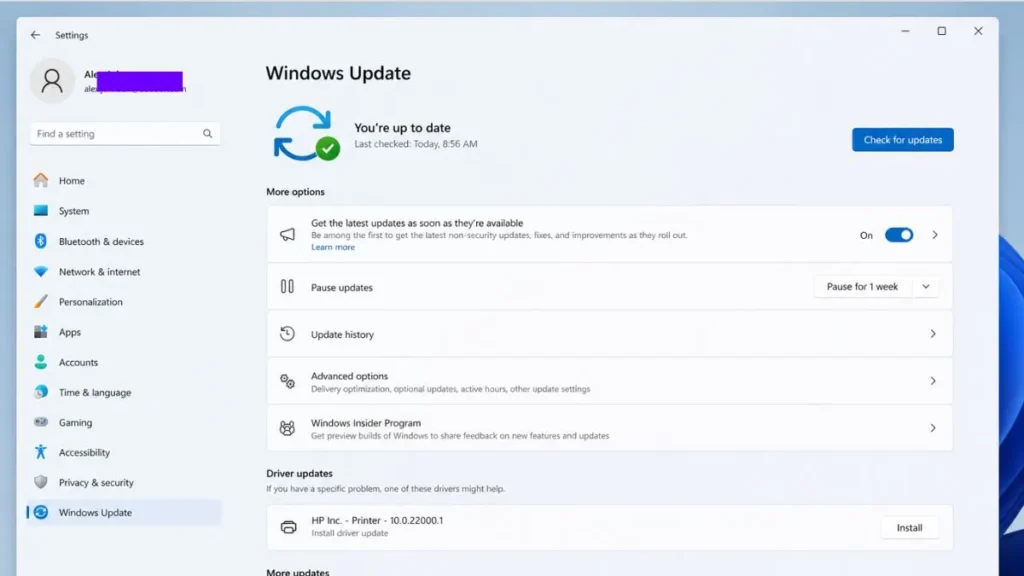 Windows 11 Settings app showing Windows Update page with update status, check for updates button, pause updates option, update history, and advanced options in a clean modern interface