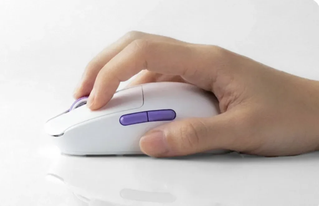 Hand gripping the Akko Dash Master gaming mouse showing side buttons and ergonomic curve