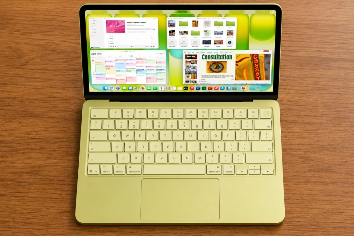 Top view of Apple MacBook Neo 13 showing keyboard, trackpad, and display interface.