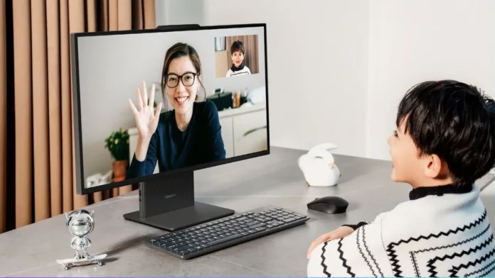 Lenovo Xiaoxin Pro 27 all-in-one desktop used for a video call with a child sitting at a desk