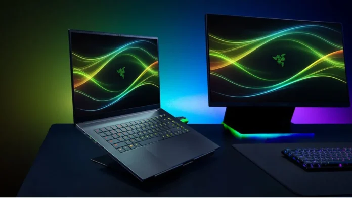 Razer Blade 16 laptop connected to an external display with RGB lighting in a gaming desk setup