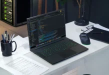 Razer Blade 18 (2026) Released With RTX 5090 and Dual-Mode 240Hz/440Hz Display Razer Blade 18 laptop running code editor on a desk setup with gaming mouse