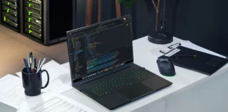Razer Blade 18 (2026) Released With RTX 5090 and Dual-Mode 240Hz/440Hz Display Razer Blade 18 laptop running code editor on a desk setup with gaming mouse