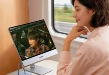 Ugreen Releases AP16 Portable Monitor With 2.5K, 165Hz Display and 500-Nit Brightness Person using the Ugreen AP16 portable monitor during travel