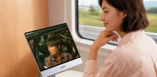 Ugreen Releases AP16 Portable Monitor With 2.5K, 165Hz Display and 500-Nit Brightness Person using the Ugreen AP16 portable monitor during travel
