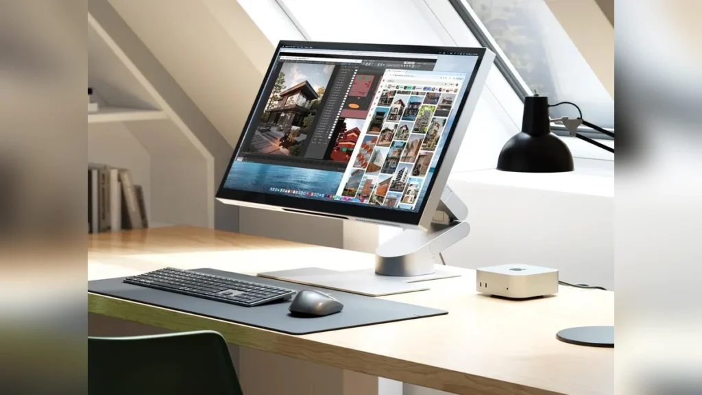 A desk setup displaying the ALOGIC Aspekt Touch 27-inch docking monitor next to a Mac Studio, framed with a blurred background.