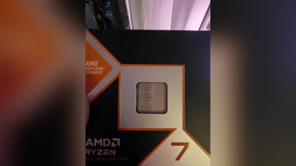 The retail box of an AMD Ryzen 7 9800X3D processor showing the security seal and labeling.
