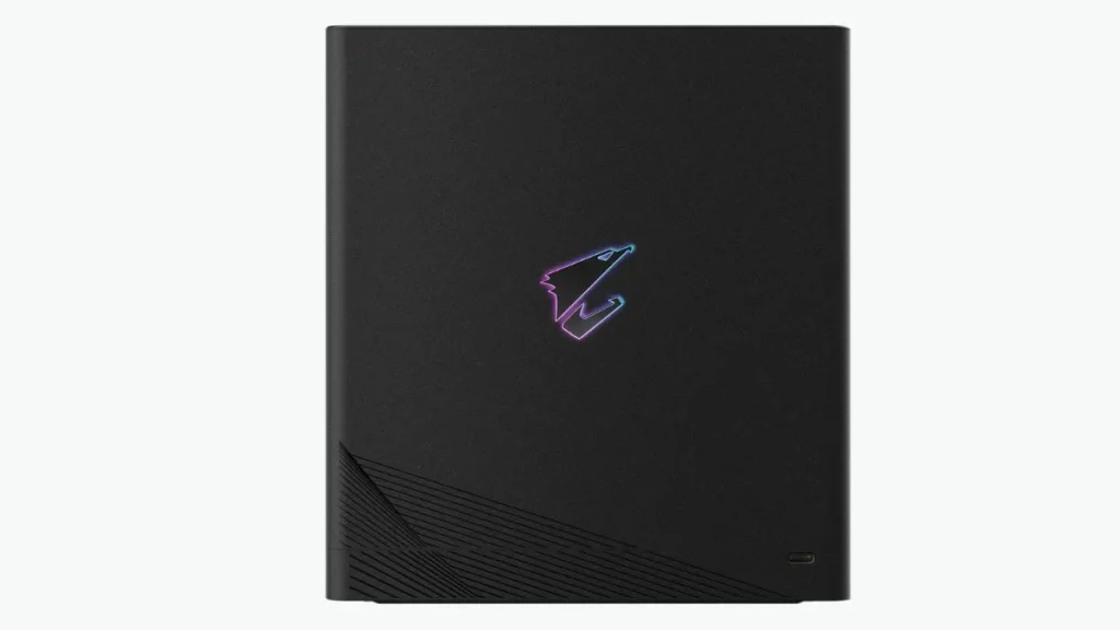 Front view of AORUS RTX 5090 AI BOX with RGB Falcon logo and compact chassis design