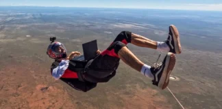 ASUS ProArt GoPro Edition Laptop Highlights Red Bull Namibia Partnership Red Bull athlete Dani Román editing video on the ASUS ProArt GoPro Edition (PX13) laptop in mid-air above the desert.
