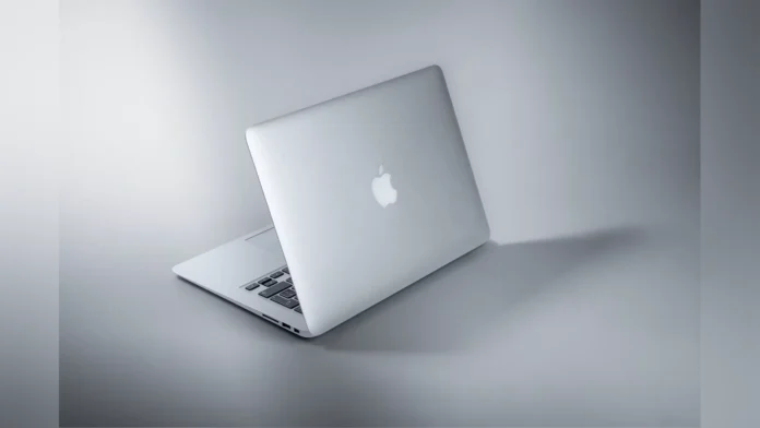 Rear view of an open silver Apple MacBook notebook highlighting the logo.