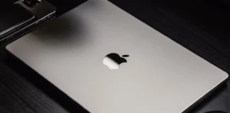 Apple Plans to Skip M6 Pro and M6 Max Chips to Launch M7 Silicon Silver Apple MacBook Pro laptop showing the black Apple logo on its lid.