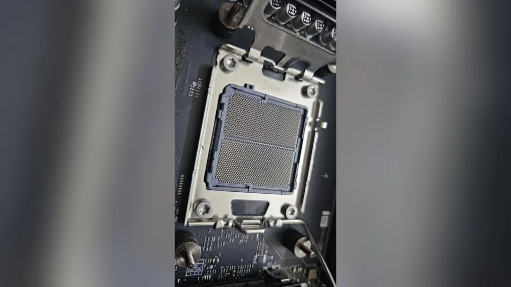 AMD Ryzen 9 9900X CPU Fails with Physical Substrate Swelling 3 Close-up vertical view of AM5 socket pins.