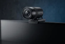 Dell Launches Pro 7 4K and Pro 5 2K Webcams Globally Dell Pro 7 4K webcam mounted on a monitor featuring a premium lens design for professional video conferencing