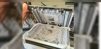 Gigabyte RTX 5090 Owner Discovers Excess Thermal Material After High Fan Speeds Disassembled Gigabyte AORUS RTX 5090 showing excess factory thermal gel.