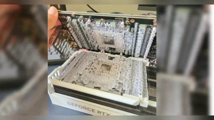 Disassembled Gigabyte AORUS RTX 5090 showing excess factory thermal gel.