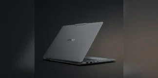 Lenovo Yoga Pro 7 15ASH11 Sports 1,100-Nit OLED and Strix Halo Silicon Professional product shot of the dark-grey Lenovo Yoga Pro 7 15ASH11 laptop lid standing upright on a reflective dark studio floor, highlighting the Lenovo logo.