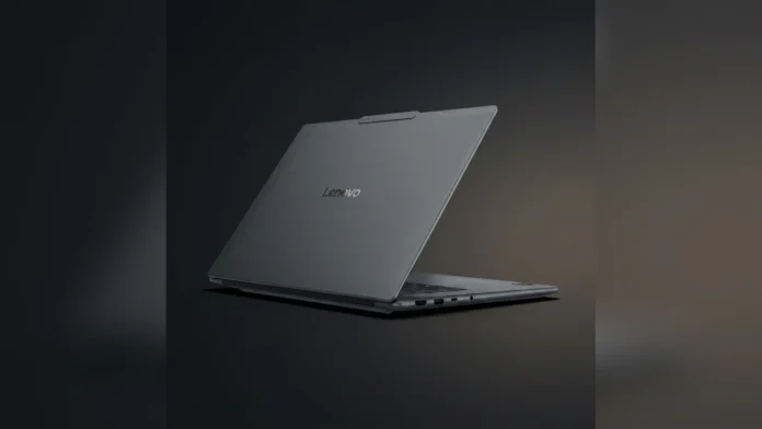 Professional product shot of the dark-grey Lenovo Yoga Pro 7 15ASH11 laptop lid standing upright on a reflective dark studio floor, highlighting the Lenovo logo.