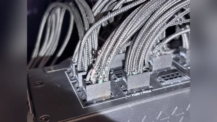 Melted 16-pin power connector on an NVIDIA GeForce RTX 5090 graphics card.