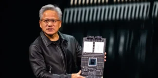 NVIDIA Vera Rubin NVL72 AI Racks Ship to CoreWeave and Oracle NVIDIA CEO Jensen Huang holding the new Vera Rubin superchip/board on stage.