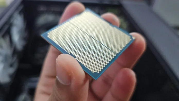 Underside contact pads of failed Ryzen 9 9900X CPU showing substrate swelling.