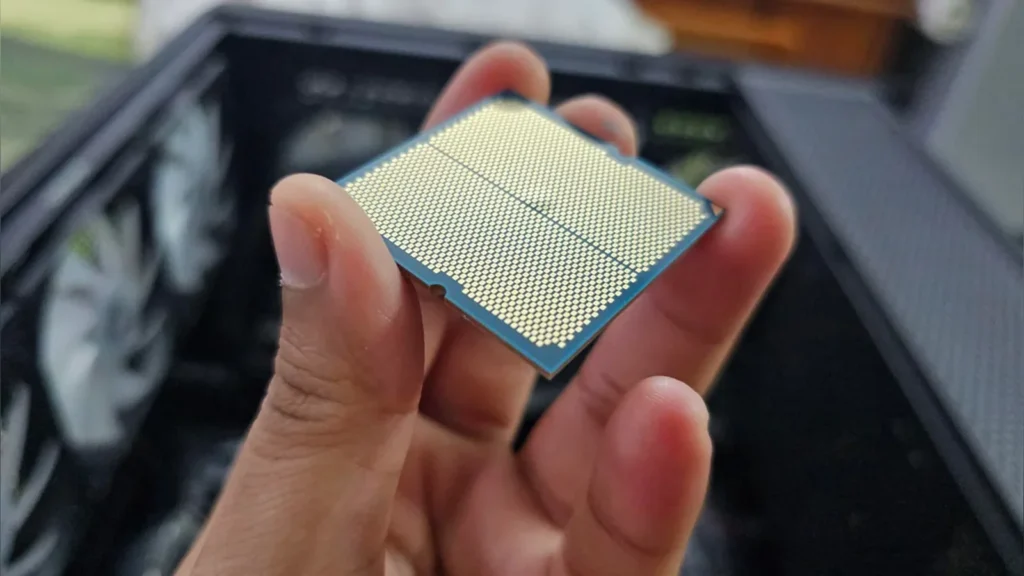 AMD Ryzen 9 9900X CPU Fails with Physical Substrate Swelling 1 Alternative angle of Ryzen 9 9900X CPU contact pads with blister.