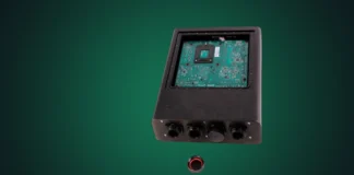 Silent PC Sells Fanless IP65-Rated Ryzen 9000 Desktop for $3,350 Silent PC waterproof and fanless computer isolated on a professional dark green studio radial spotlight background.