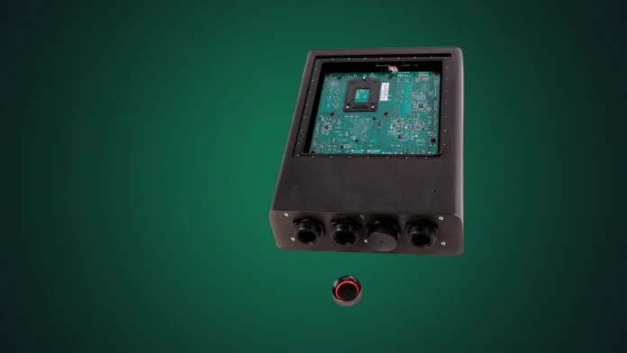 Silent PC waterproof and fanless computer isolated on a professional dark green studio radial spotlight background.