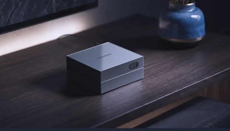 Lenovo AI Host Mini PC placed on a desk in a home office environment
