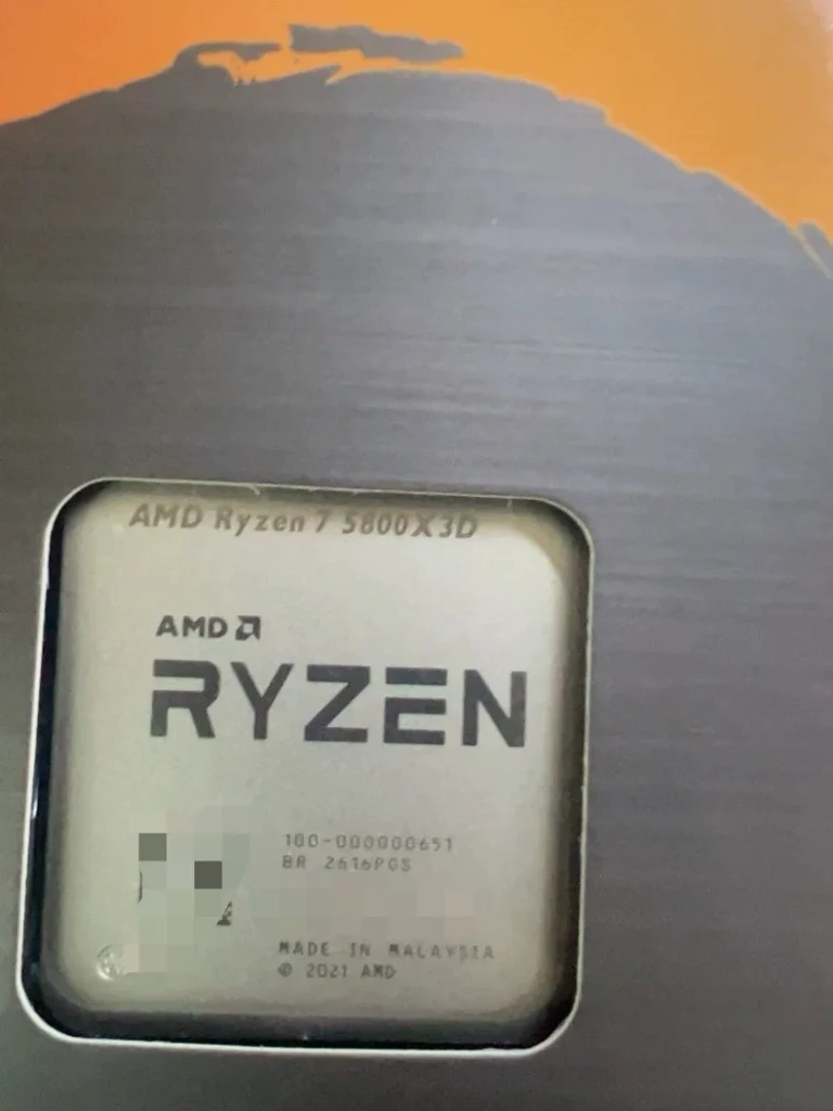 Close-up view of the AMD Ryzen 7 5800X3D processor inside its retail packaging