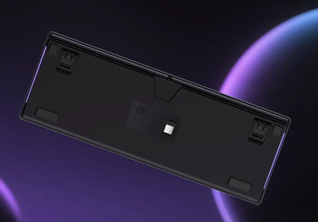 Lenovo Lecoo GK101 Gets Tri-Mode Wireless and Hot-Swap Support 3 Bottom side of the Lenovo Lecoo GK101 keyboard showing foldable feet and receiver storage compartment