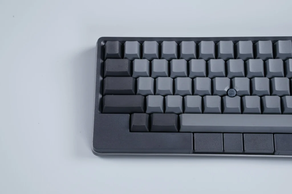 Close-up of the Ash Gray keyboard showing corner design, keycaps, and pointing stick