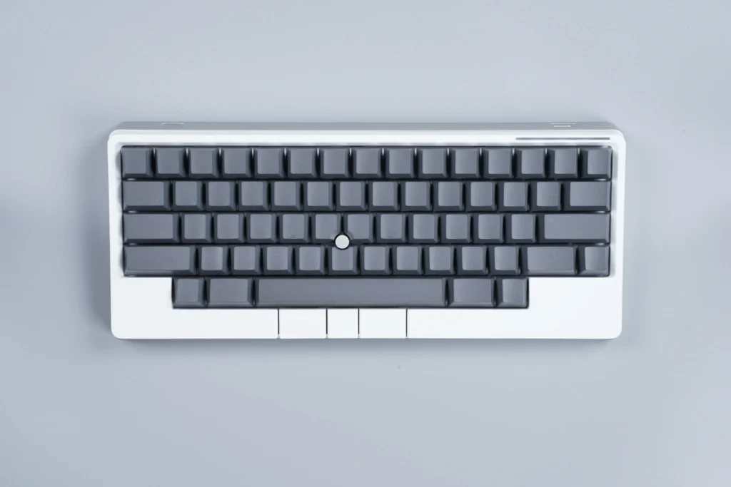 White edition compact mechanical keyboard with gray keycaps and integrated pointing stick