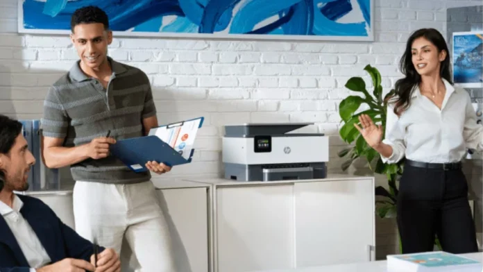 HP AI workplace setup featuring business users collaborating beside an HP multifunction printer