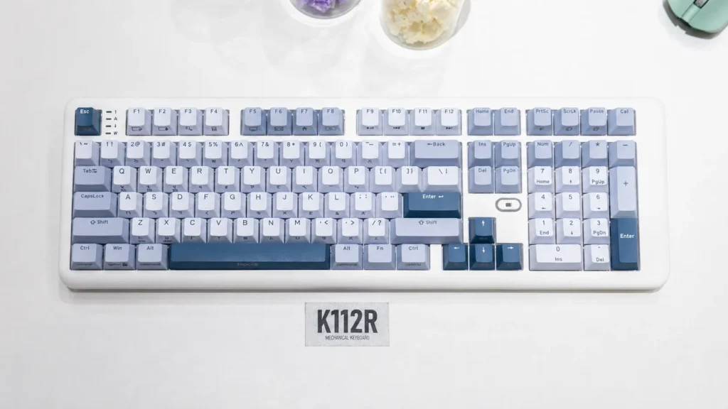 iRocks Showcases K112R, K114H Keyboards and M27R Mouse at Computex 2026 1 Top view of the iRocks K112R mechanical keyboard with blue and white keycaps