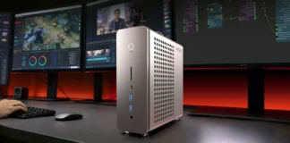 MINIX ER939-AI Pro Mini PC Combines Ryzen AI Max+ 395, and 128GB Memory MINIX ER939-AI Pro compact workstation positioned on a desk with multiple productivity displays