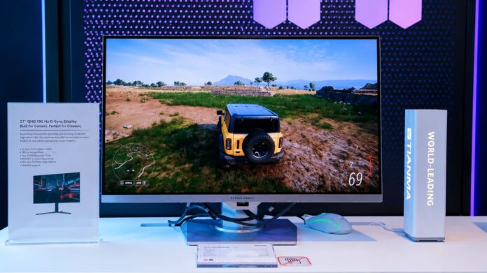 Tianma 27-inch QHD gaming monitor panel featuring a 180Hz refresh rate and G-Sync support showcased during a technology exhibition